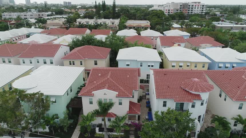Rooftops of homes and buildings in a neighborhood