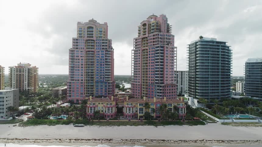 Skyscrapers stand on a beach