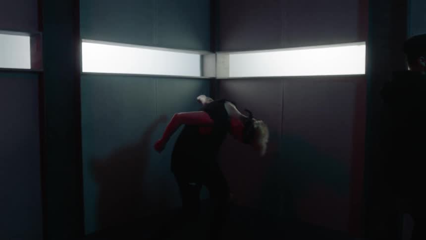 Two  men do dance moves in a building