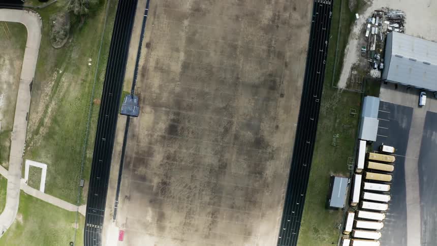 A racetrack sits in a town