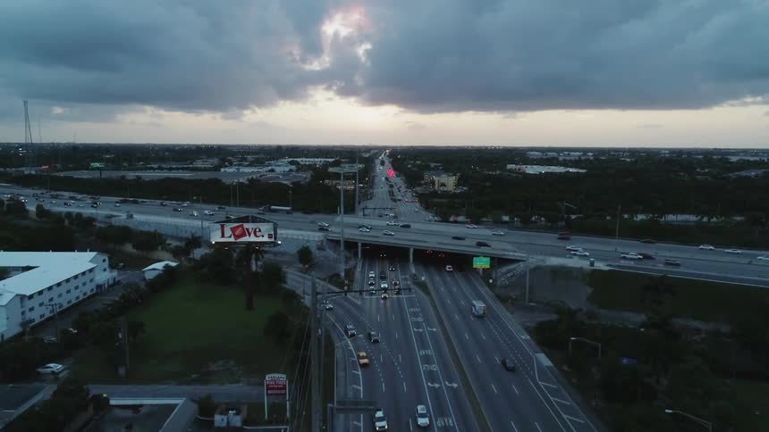 Cars drive on a city highway