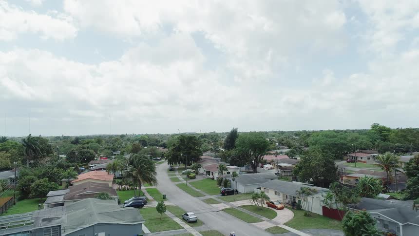 Houses sit in a neighborhood