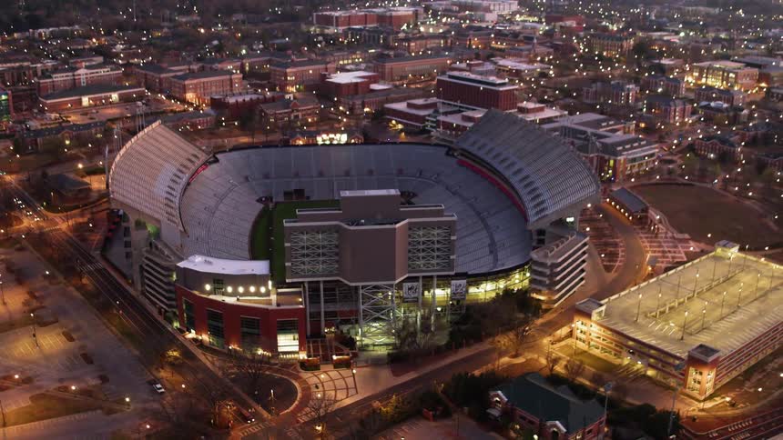 The stadium is brightly lit at dawn