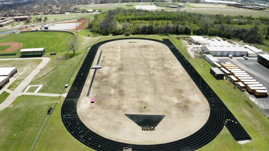 A racetrack sits in a town