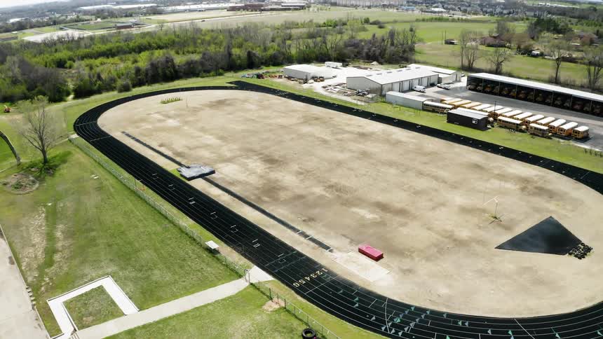 A racetrack sits in a town