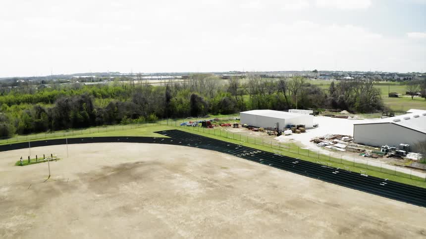 A racetrack sits in a town