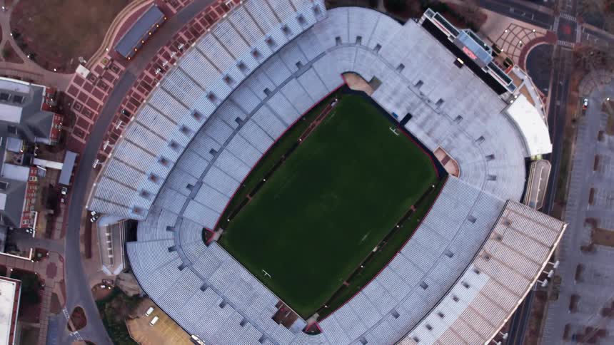 An athletic stadium sits in a city