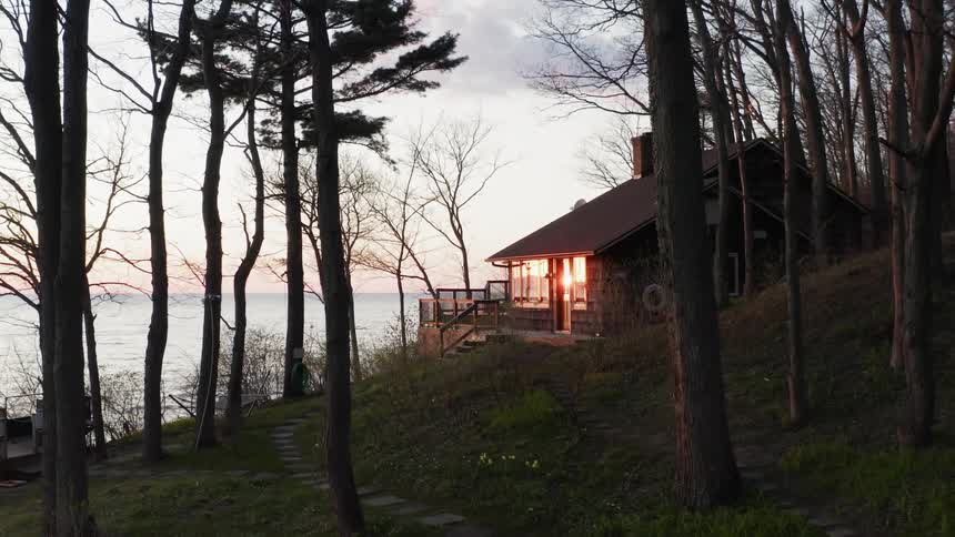 The sun shine reflects off the cabin house