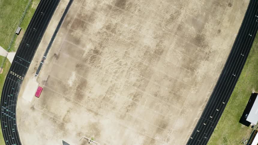 A track & field facility is waiting empty during the day