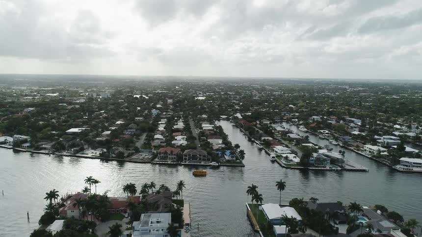 Homes with docks and boats line the canals
