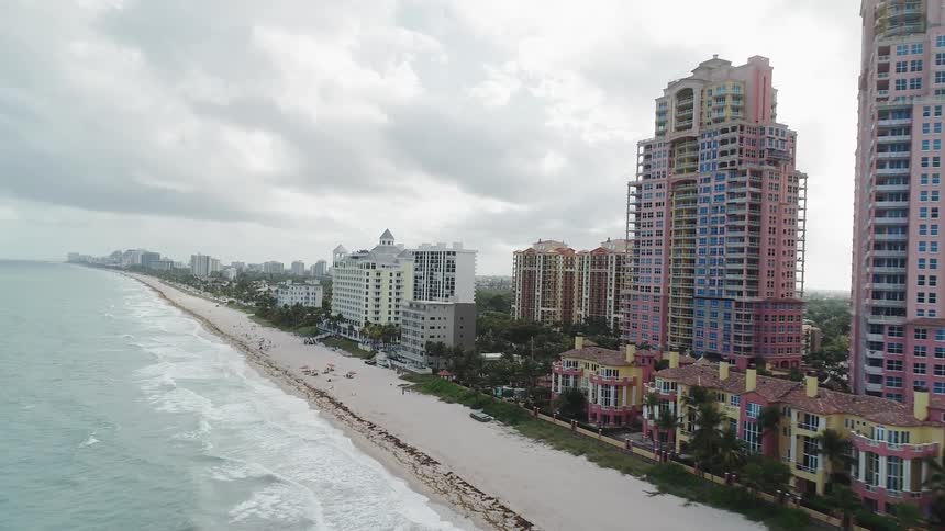 The tall buildings line the ocean