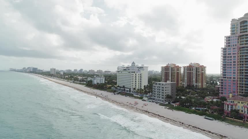 City on ocean coast on cloudy day