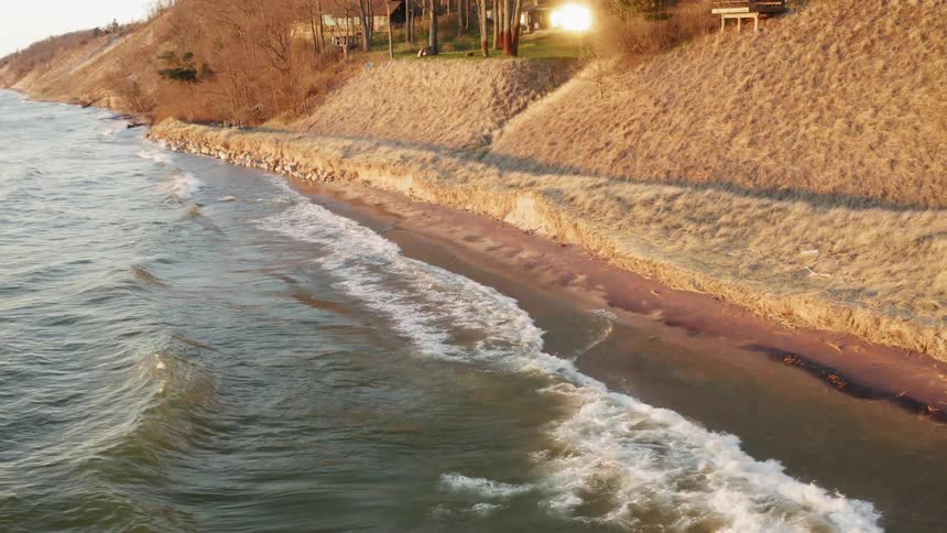 Waves crash into a shoreline