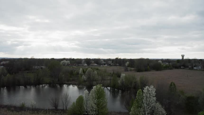 Clouds hang above the rural landscape