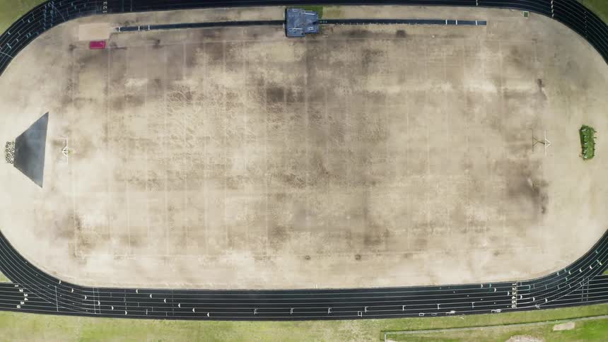 The stadium below is empty on a sunny day
