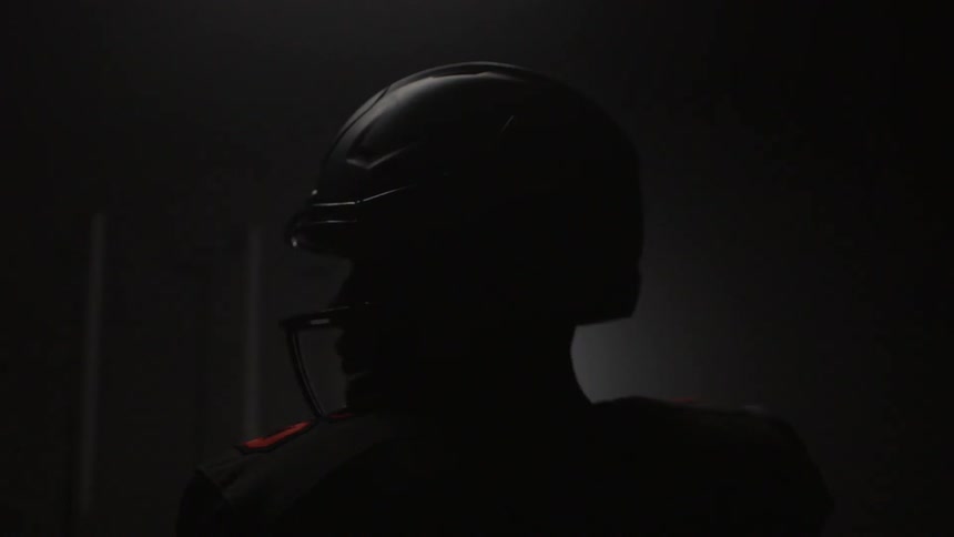 The football player is looking to the side