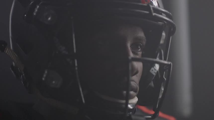 Lights flash around a football player
