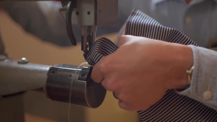 A person is using a sewing machine
