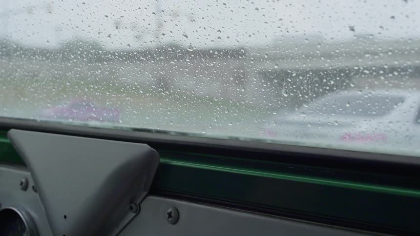 The window is covered with water as it rains