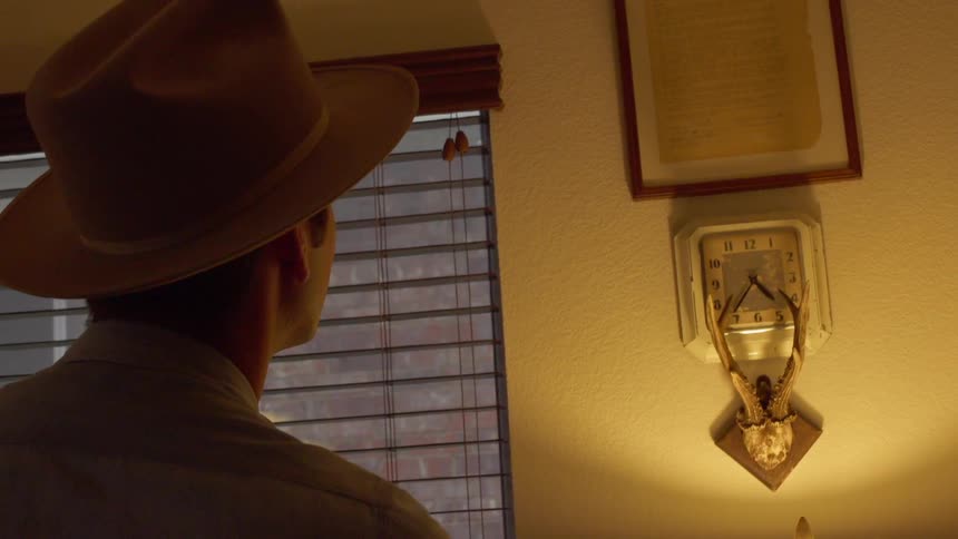A man looks at the sign on the wall