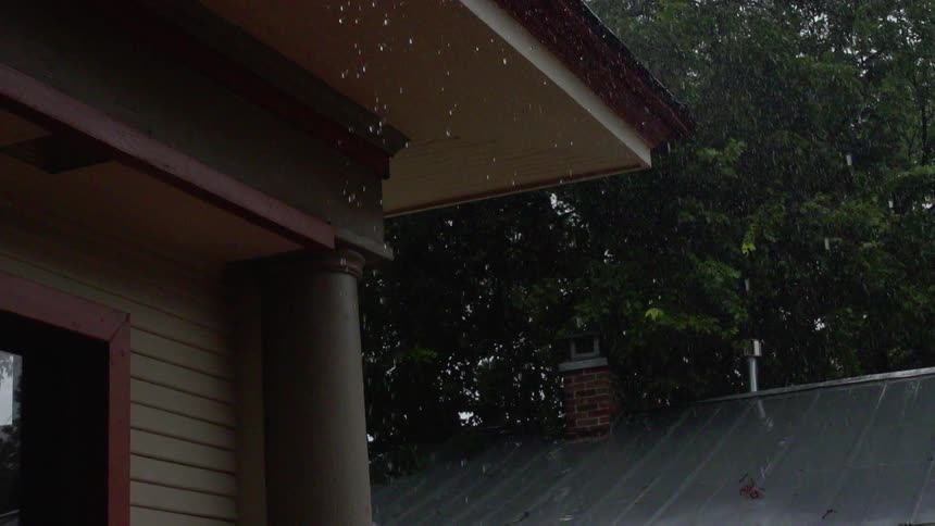 The snow starts to fall on the house