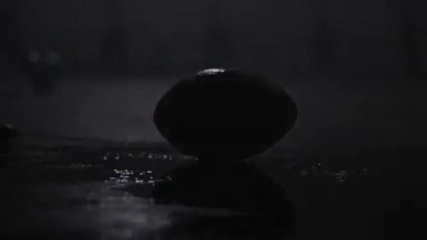 A football drops into a puddle
