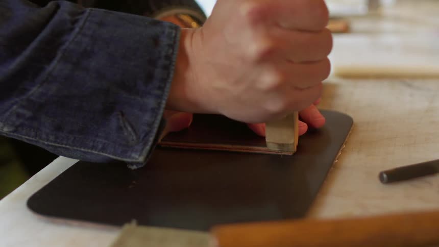 A man is working in a shop