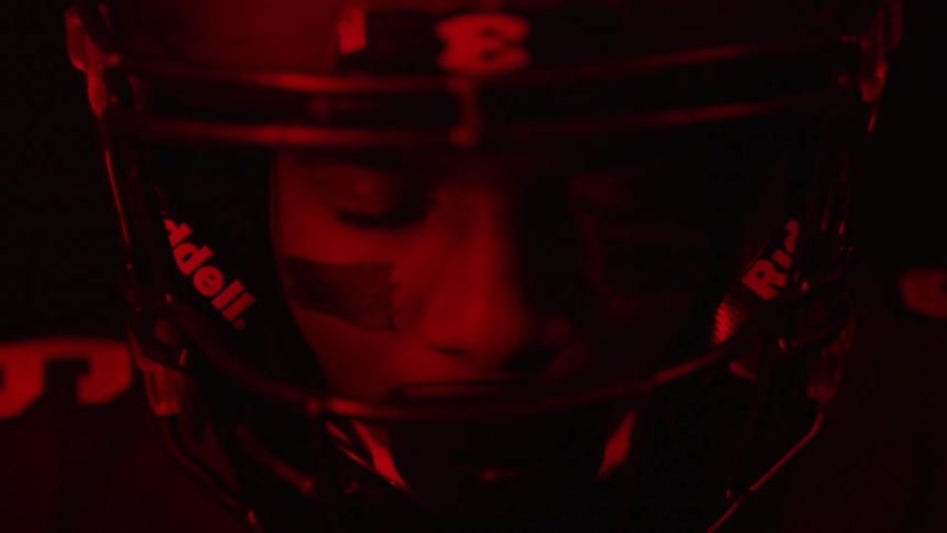 The football player has red lights flashing on him