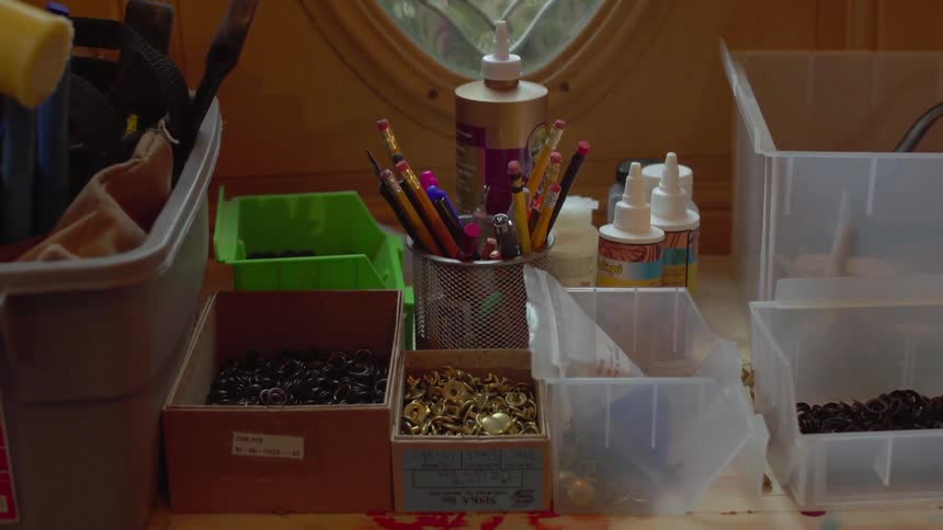 Craft supplies are laid out on the counter