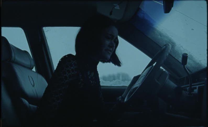 The woman cries in the car