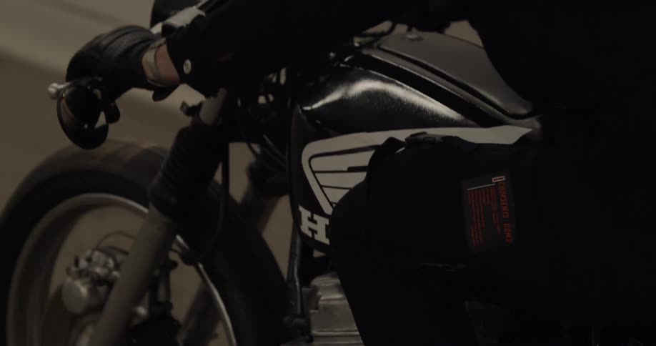 A man rides a motorcycle