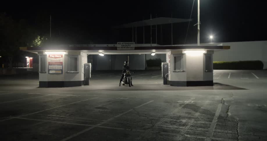 A man turns on the headlamp of a motorcycle