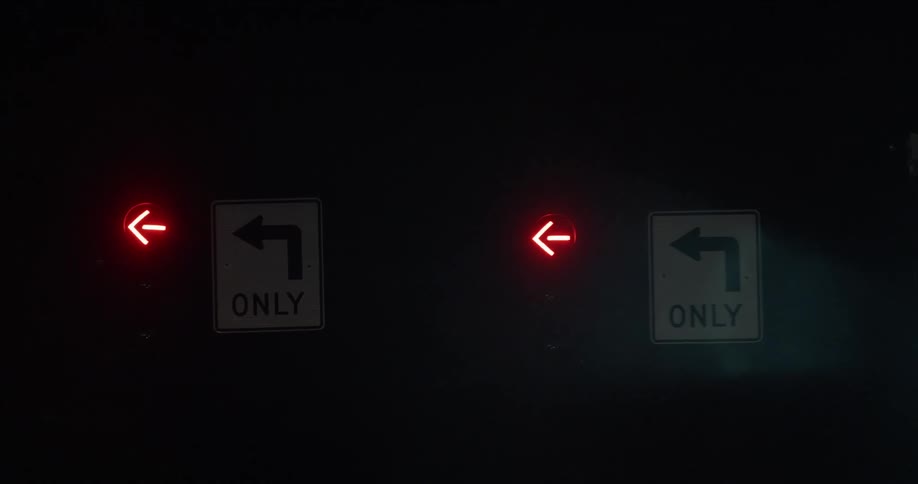 Red arrows illuminated near the left turn signs
