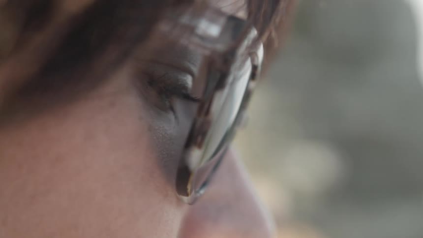 Woman reading or studying behind her eyeglasses