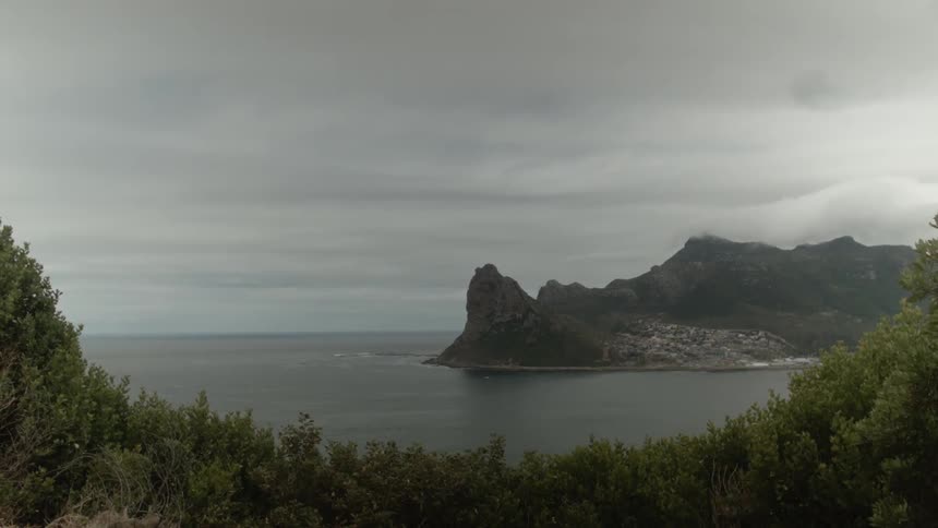 A bay and rock formation during an overcast day