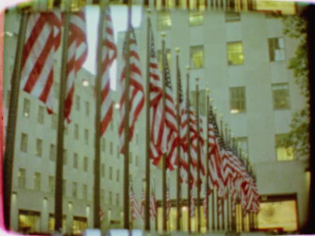 Flags sway in the breeze during the day