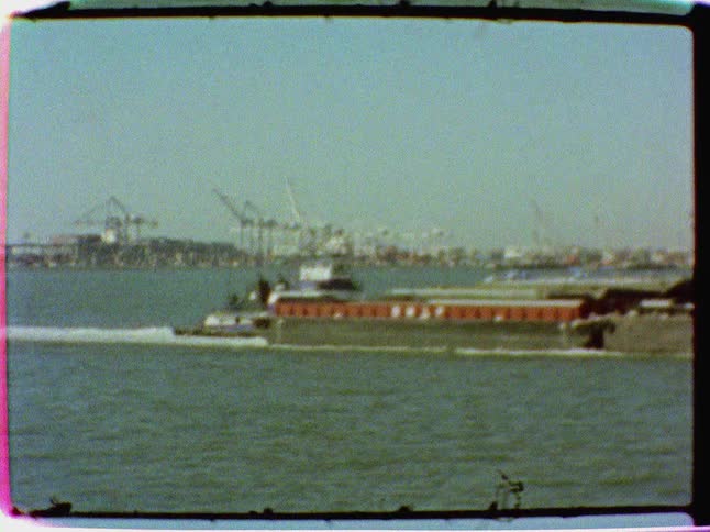 Barge traveling along a crowded waterway