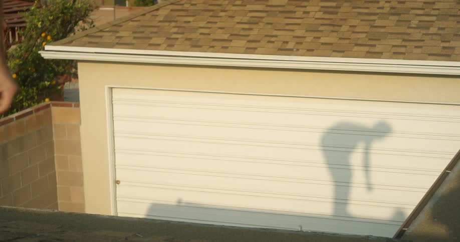The woman is doing gymnastics and giving off a shadow