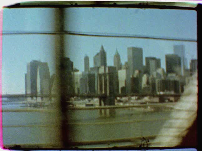 Cityscape seen from vehicle moving on a bridge