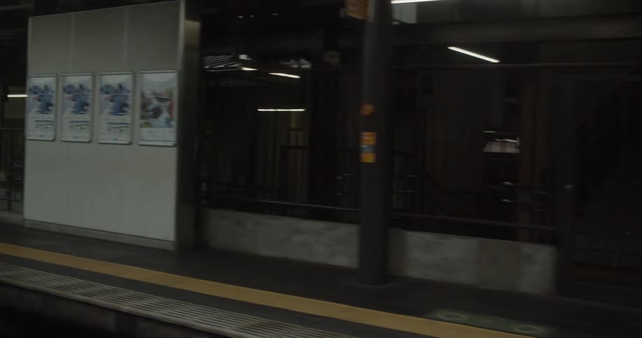 Person sits on the bench in a train station