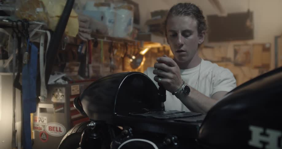 A man works on a motorcycle