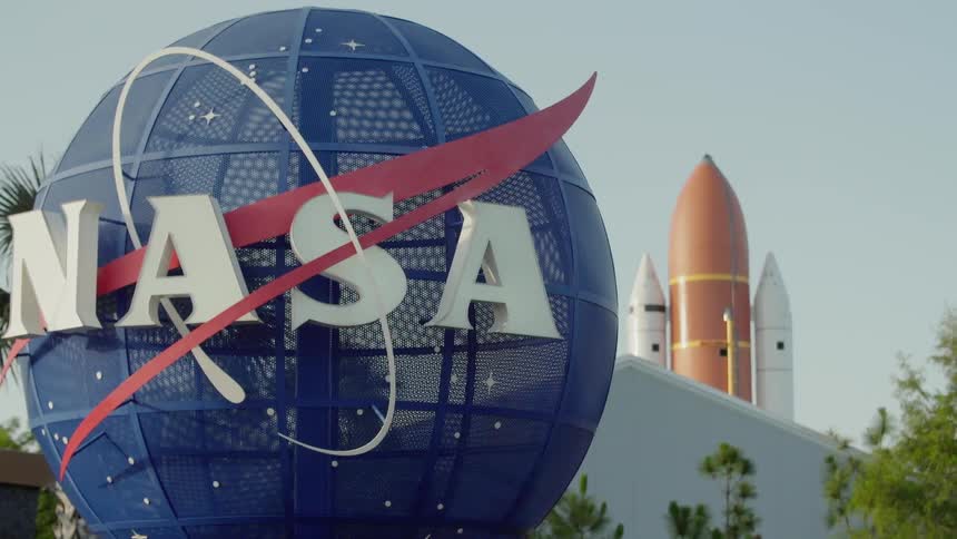 The sign in front of the rocket says nasa
