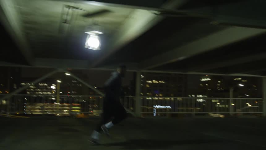Man runs in the underground parking area