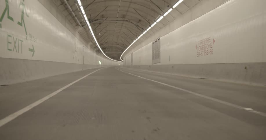 A vehicle drives through a city tunnel