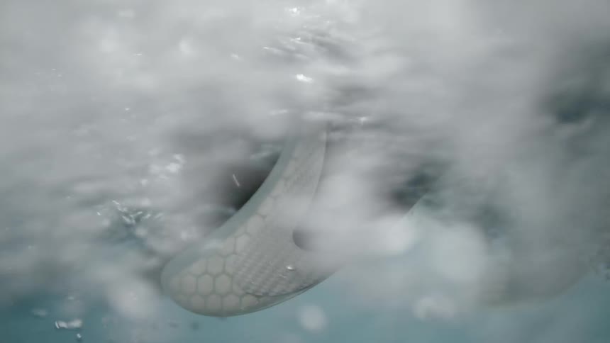 Feet are dipped into the water