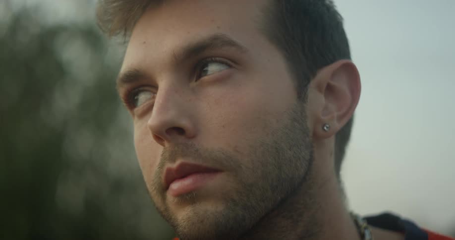 A man looks around outside