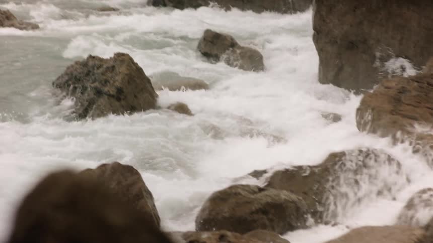 Ocean waves splash up on the rocks