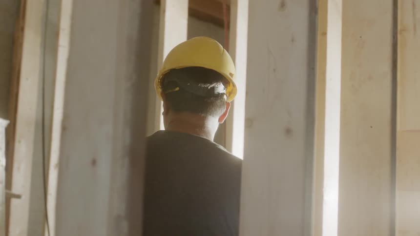 Builders work on a building site