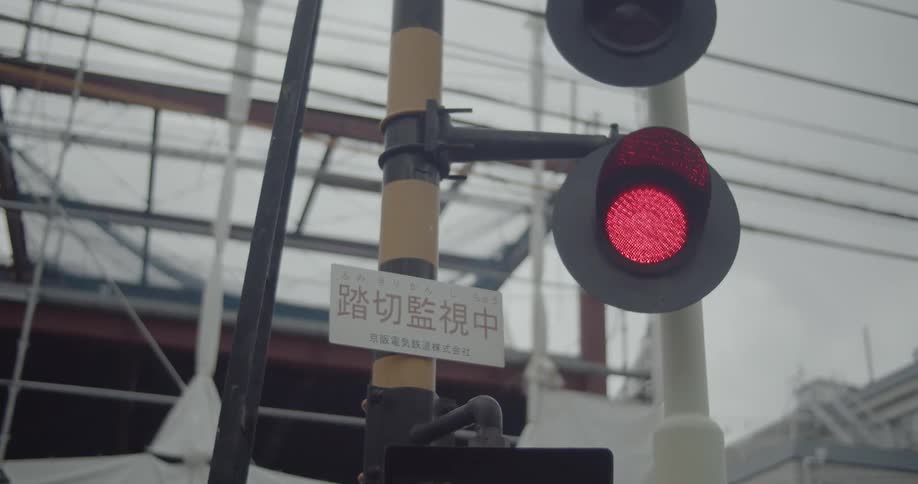 Lights flash at a railroad crossing