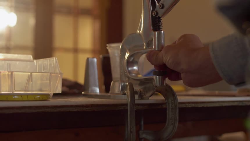A man adjusts a vise grip tool